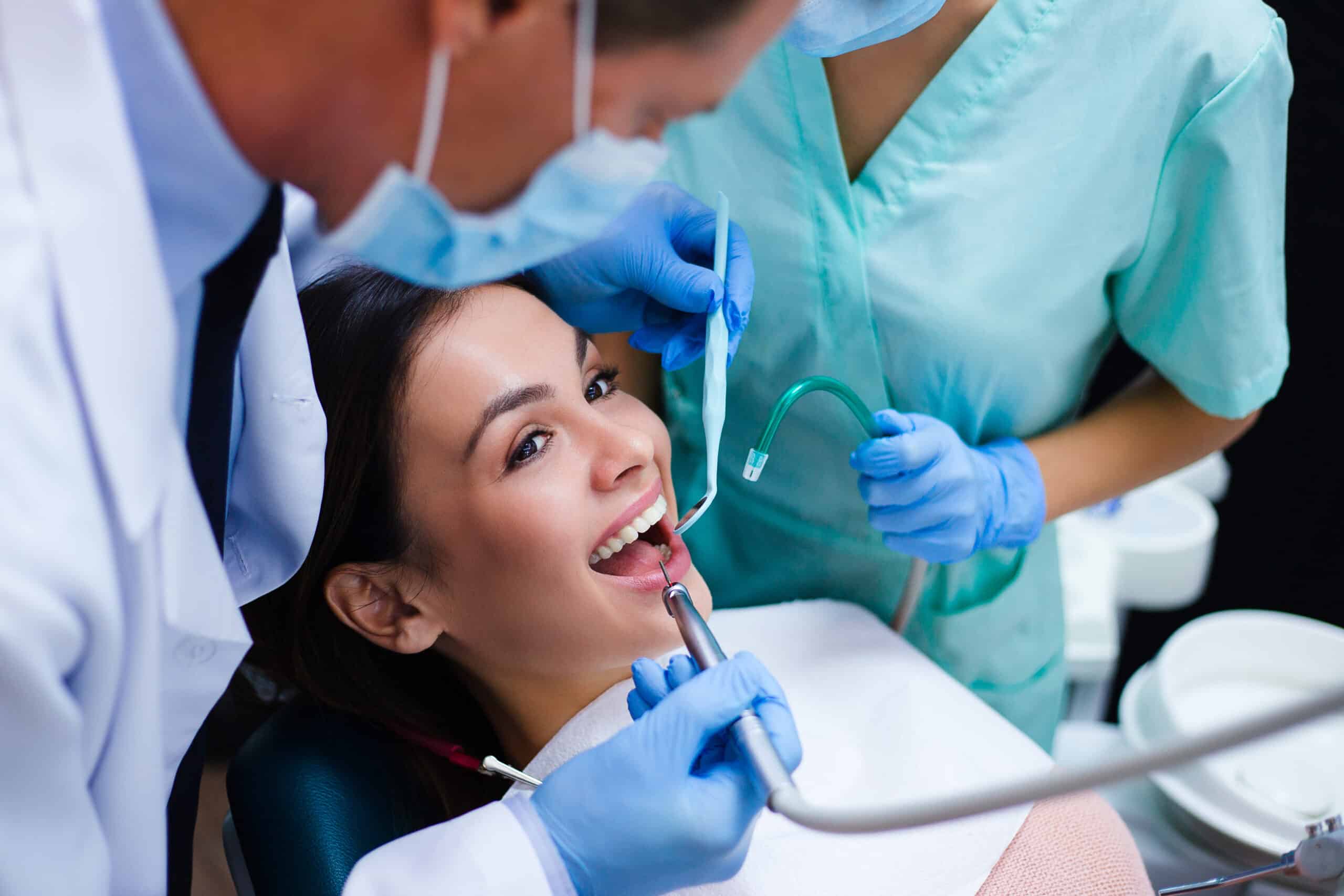 Top dentist in Vancouver consulting with a patient at a modern dental clinic